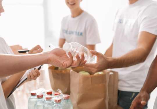 cropped-shot-of-volunteers-with-food-and-drinks-fo-2022-11-02-00-44-58-utc (1)