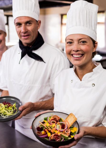 group-of-chefs-holding-plate-of-prepared-food-in-62MPWNQ-e1563435447331 (1) school canteen catering